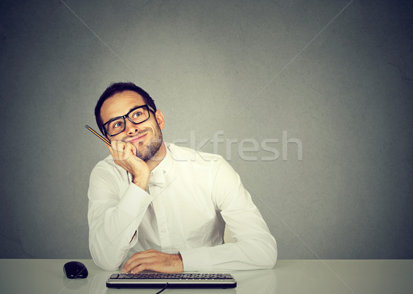 young funny business man thinking daydreaming   Stock photo © ichiosea