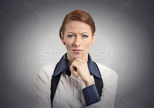 Kétséges nő néz kamera izolált szürke Stock fotó © ichiosea