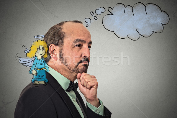 guy listening with sketched angel on his shoulder whispering in his ear Stock photo © ichiosea