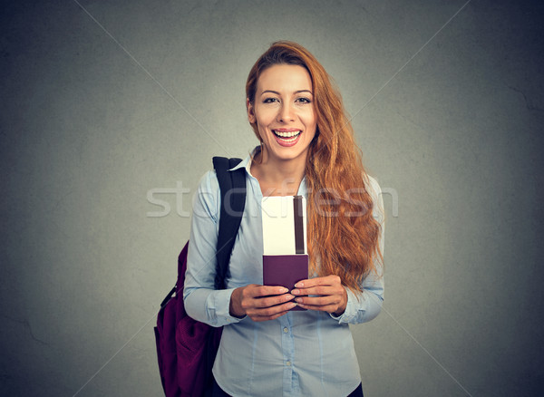 Happy tourist young woman holding passport holiday flight ticket Stock photo © ichiosea