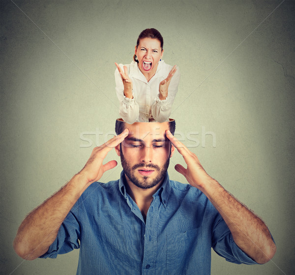 Stressed man with open head and screaming woman inside his brain Stock photo © ichiosea