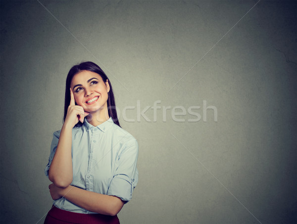 Portrait happy woman thinking looking up smiling  Stock photo © ichiosea