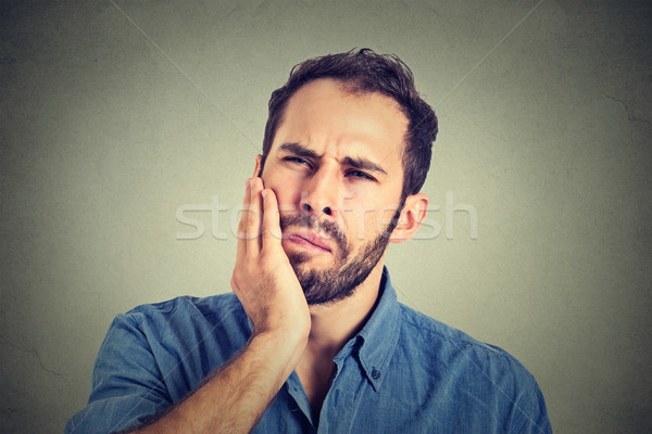 Jonge man kiespijn tand pijn student gezondheid Stockfoto © ichiosea
