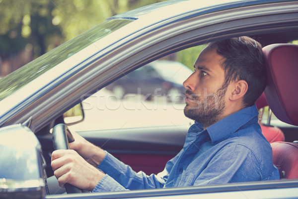scared funny looking young man driver in the car. Inexperienced anxious motorist   Stock photo © ichiosea
