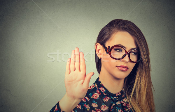 annoyed angry woman with bad attitude giving talk to hand gesture Stock photo © ichiosea