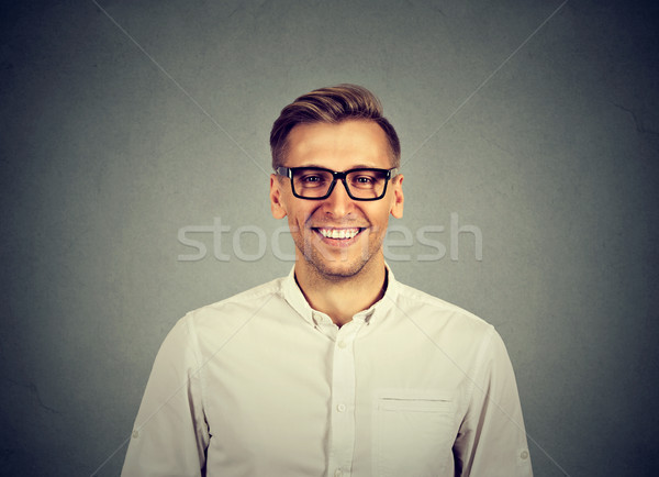 Young handsome man with great smile wearing fashion eyeglasses  Stock photo © ichiosea