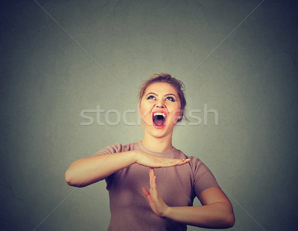Stock photo: woman showing time out hand gesture, frustrated screaming to stop 