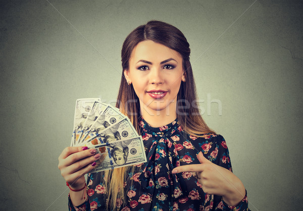 happy excited successful young business woman holding money dollar bills in hand Stock photo © ichiosea