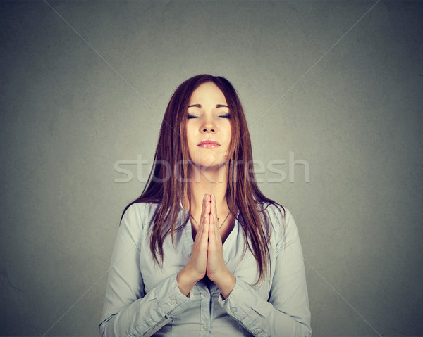 Portrait of a young woman praying Stock photo © ichiosea