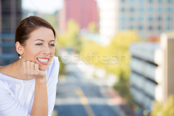Beautiful smiling young woman enjoying her day on a balcony of her apartment  Stock photo © ichiosea