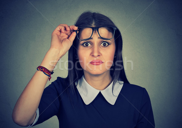 Szkeptikus nő néz rosszallás arc szemüveg Stock fotó © ichiosea