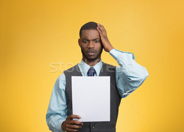 Man holding paper, statement, shocked with bad news Stock photo © ichiosea