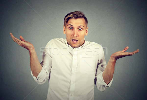 Stock photo: Ignorance arrogance. man shrugging shoulders who cares I don't know 