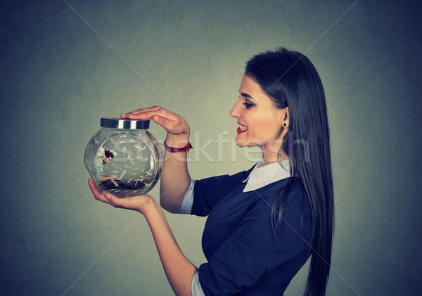 Woman holding a jar with imprisoned man in it  Stock photo © ichiosea