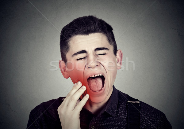 Uomo delicato mal di denti corona problema piangere Foto d'archivio © ichiosea