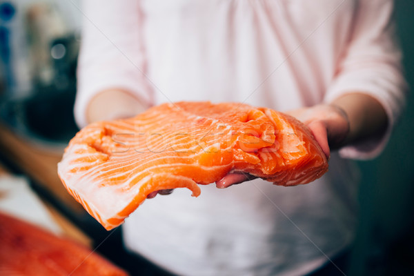 Stock photo: Raw salmon in woman hands