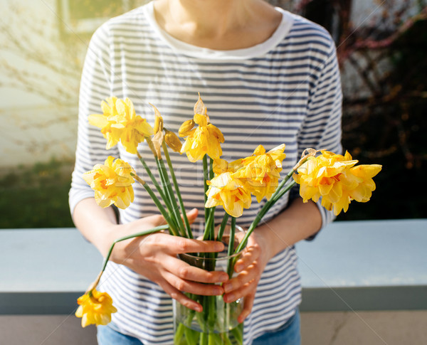 Woman holding vase with narcissus  Stock photo © ifeelstock