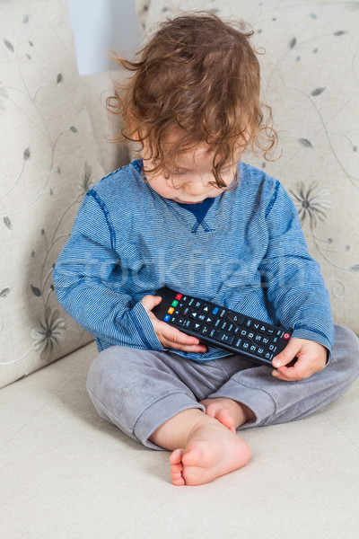 Stock photo: Baby boy with remote
