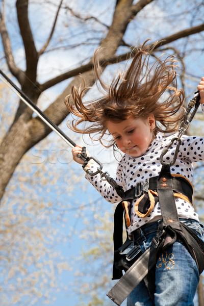 Little girl in a bungee Stock photo © igabriela