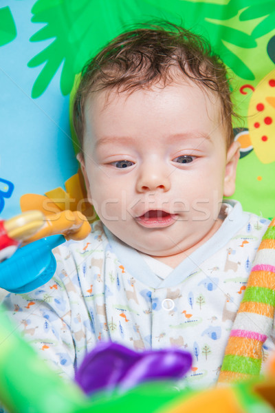 Stock photo: Baby boy on playmat