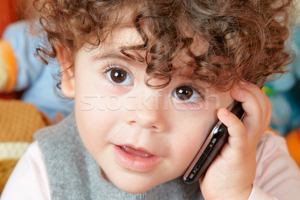 Baby girl talking on phone Stock photo © igabriela