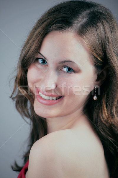 Young woman smiling at camera Stock photo © igabriela
