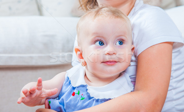 Stock photo: Baby girl in sister arms