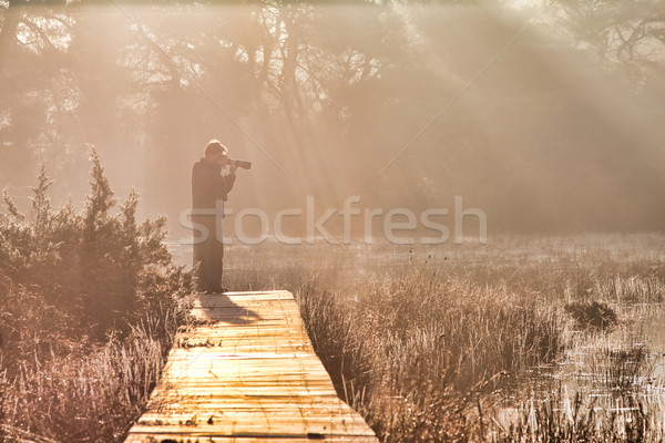 Photographer at sunrise Stock photo © igabriela