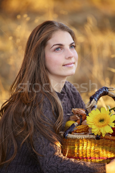 Stock photo: Young woman with flower basket