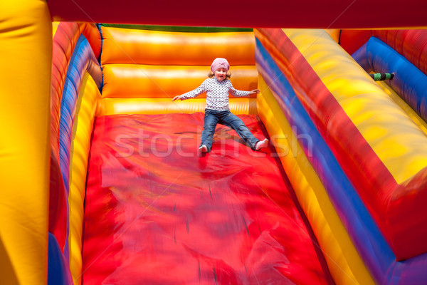 Little girl enjoying the slide Stock photo © igabriela
