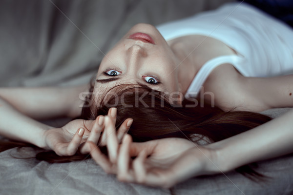 beautiful young woman lying on the floor Stock photo © igor_shmel
