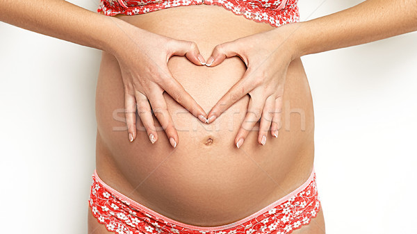Cute incinta pancia cuore attesa Foto d'archivio © igor_shmel