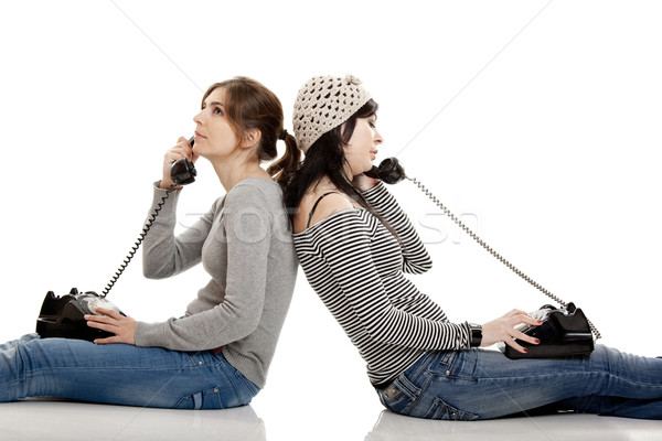 Gespräch zwei junge Frauen sprechen alten isoliert Stock foto © iko
