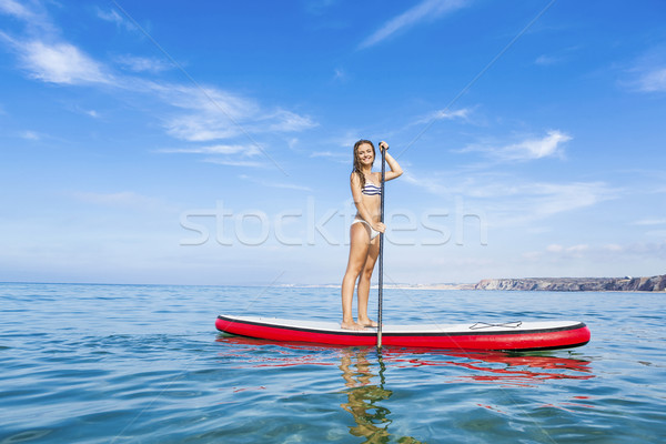 Woman practicing paddle Stock photo © iko