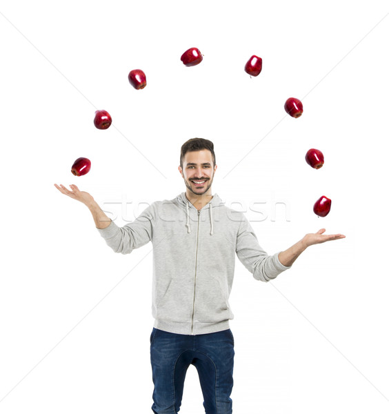 Happy man juggling with apples  Stock photo © iko