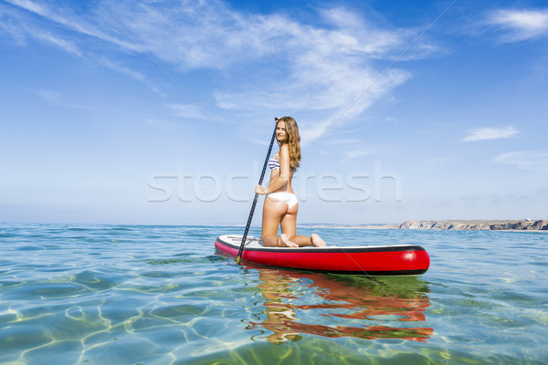 Woman practicing paddle Stock photo © iko