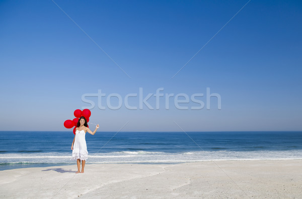 美麗的姑娘 紅色 女子 海灘 天空 商業照片 © iko