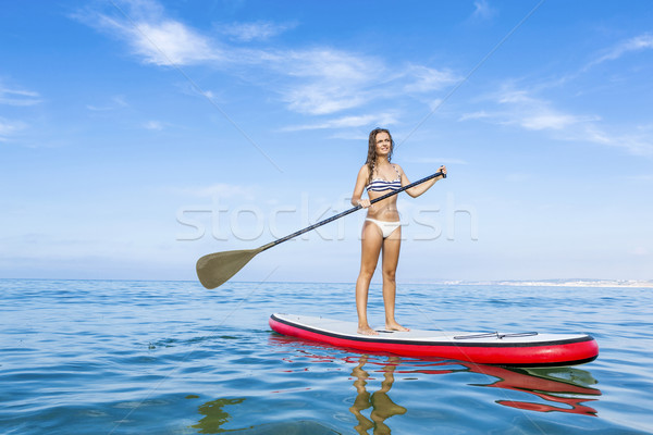 Stock photo: Woman practicing paddle