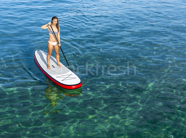 Woman practicing paddle Stock photo © iko