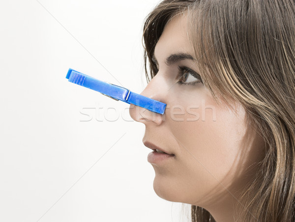 Złe zapach kobieta clothespin nosa twarz Zdjęcia stock © iko