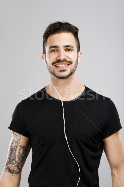 Man smiling and listen music Stock photo © iko