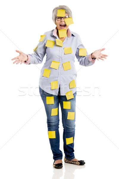 Elderly woman with yellow notes Stock photo © iko