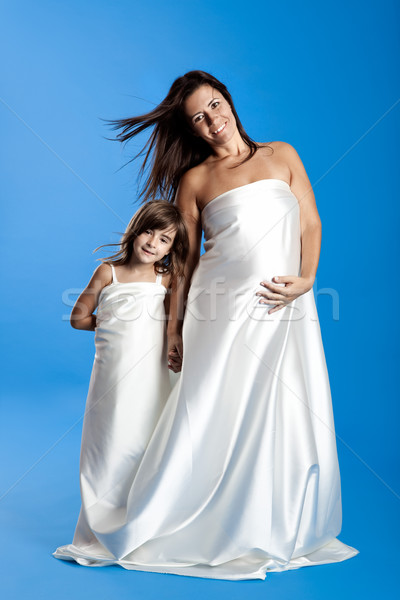 Stock photo: Pregnant woman with her daughter