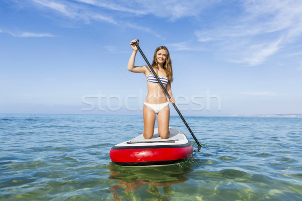 Woman practicing paddle Stock photo © iko