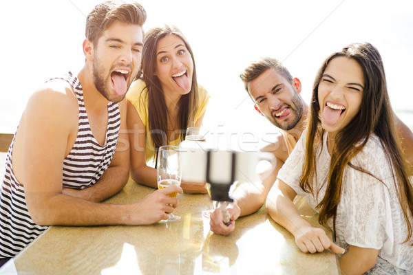 Group selfie at the beach bar Stock photo © iko