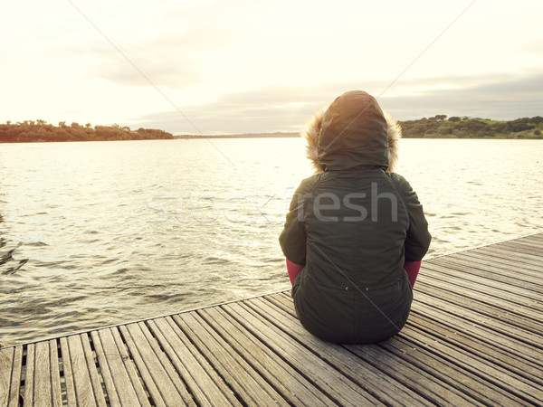 Gün göl arkadan görünüm kadın oturma yakın Stok fotoğraf © iko