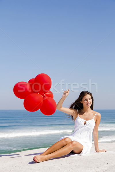 Fille rouge belle fille séance plage femme [[stock_photo]] © iko