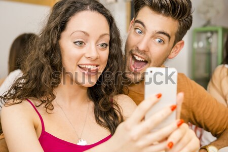 Happy couple making a selfie Stock photo © iko