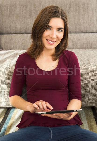 Woman using a digital tablet Stock photo © iko