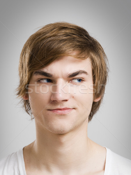 Verdacht gezicht portret knap jonge man grijs Stockfoto © iko